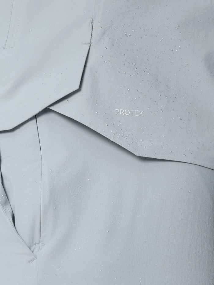 Close-up of light grey ProTek fabric with water droplets and stitching detail