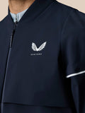 Midnight navy Pinnacle LVS woven golf jacket with white wing Castore logo on chest and zip front
