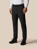 Front view of a man modeling Golf Pinnacle Winter Trousers in black with a woven belt