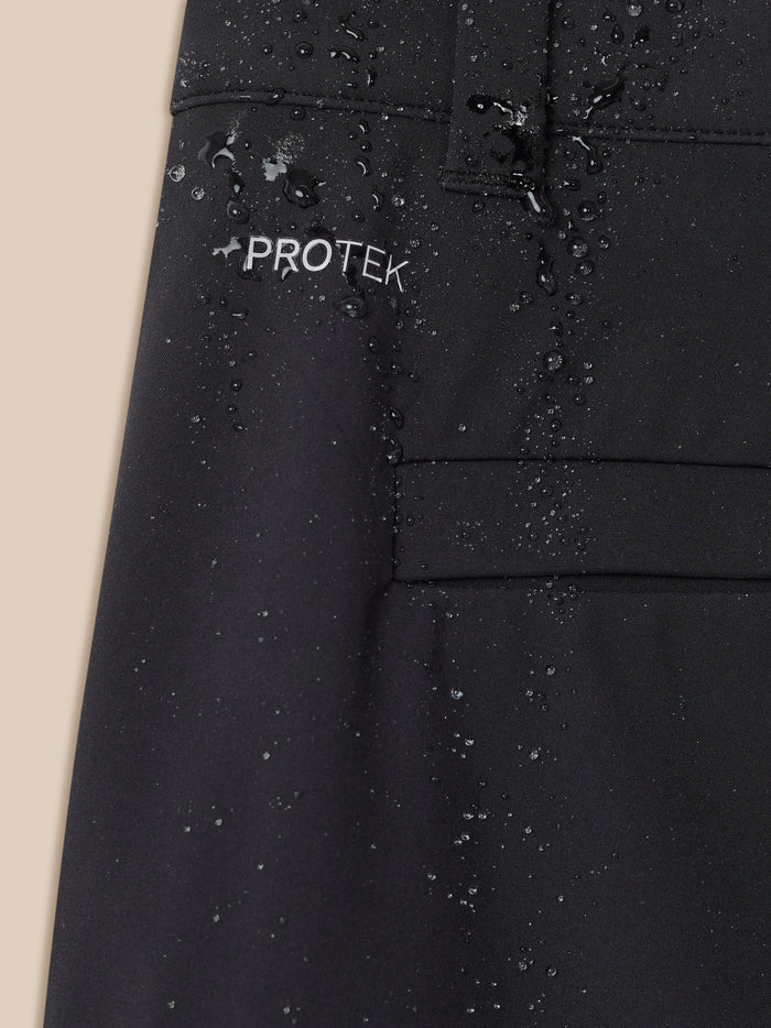 Close-up of water beading on black ProTek fabric with a ProTek label