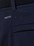 Close up of navy fabric with PROTEK branding and water droplets on the water resistant pocket area.