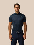 Male model in Midnight Navy striped Golf Pinnacle Glow Polo with button collar and Castore logo on left chest.