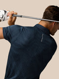 Back view of the Midnight Navy polo showing vertical stripes and Castore branding near the neckline.
