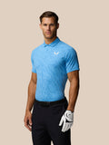 Male model wearing light blue Golf Club Glow Printed Polo with three-button placket and Castore logo on left chest