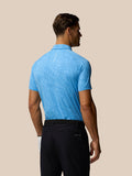 Back view of male model wearing light blue Golf Club Glow Printed Polo showing the subtle allover pattern