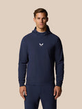 Man wearing navy Pinnacle Performance Hoodie with three-panel hood and chest logo.