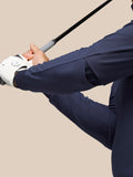 Close up of midnight navy Golf Pinnacle Performance Hoodie sleeve showing elastic panels during a golf swing.