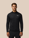 Man wearing black Golf Club Classic 1/4 Zip top with all over print and chest Castore logo