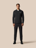 Full-length front view of a man in a black LVS Winter Jacket with center front zip and left chest logo