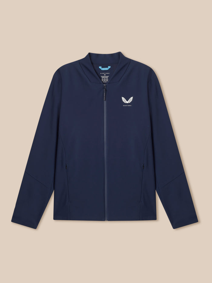Front view of a man in a midnight navy LVS Winter Jacket with full front zip and Castore logo on the chest.