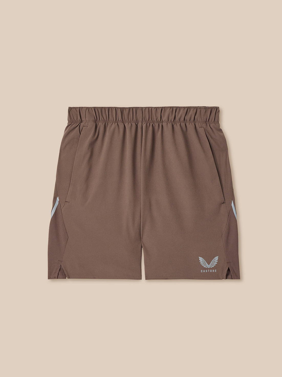 Brown shorts with a logo on a beige background