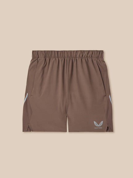 Brown shorts with a logo on a beige background