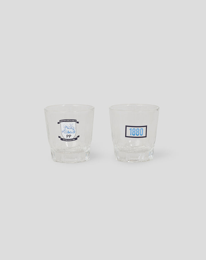 Two clear shot glasses; left features the Preston North End FC crest and the right shows a blue 1880 label.