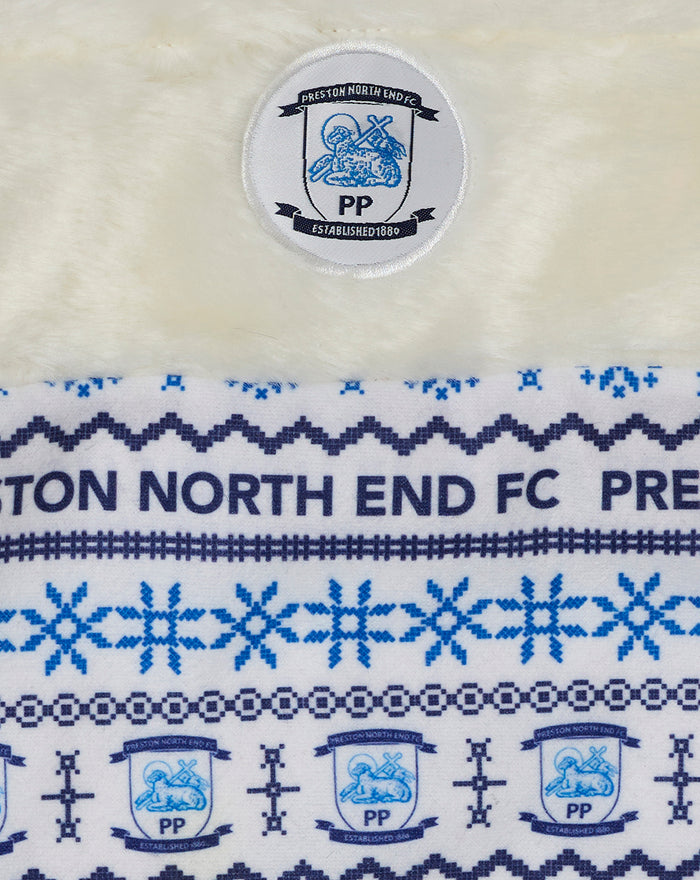 Close up of the cream stocking showing the club crest badge and blue pattern