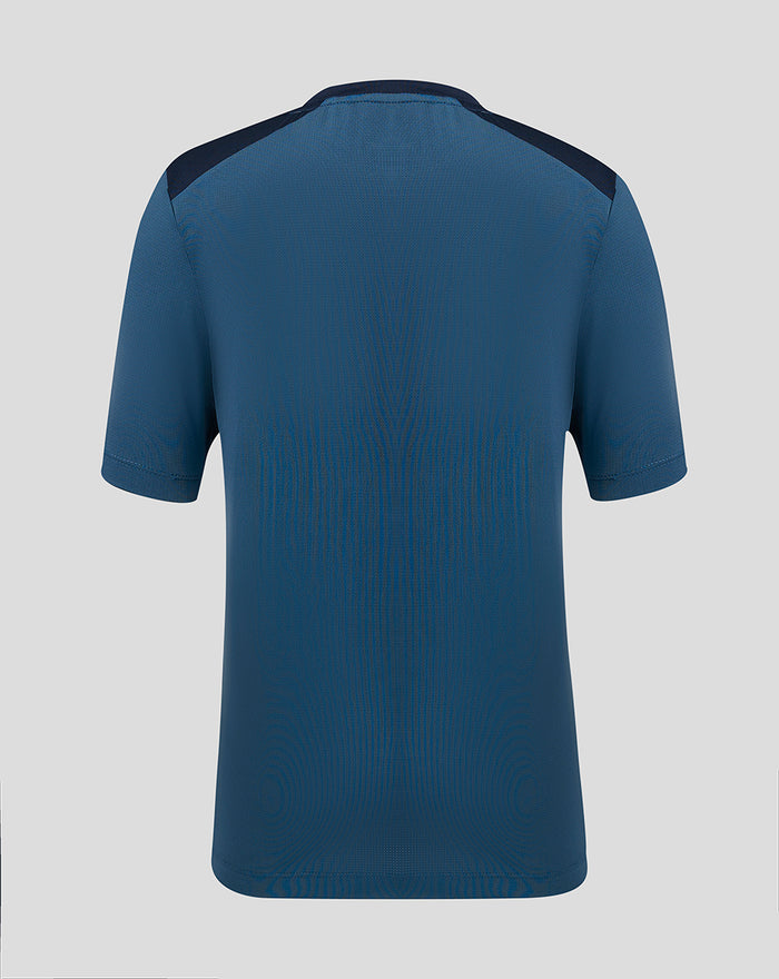 Back view of blue PNE junior training short sleeve tee with navy shoulder panels