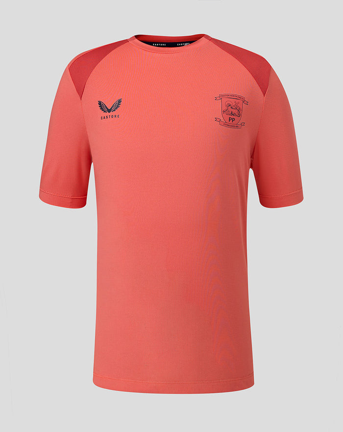 Rose pink junior training tee with Castore logo on left chest and club crest on right.