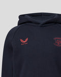 Close-up of navy hoodie fabric with coral Castore logo on left chest