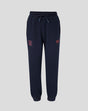 Navy Travel Adapt fleece joggers with drawstring waist, crest on the left thigh and coral branding on the right.