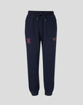 Navy Travel Adapt fleece joggers with drawstring waist, crest on the left thigh and coral branding on the right.
