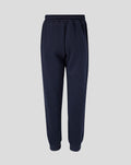 Full-length navy Travel Adapt fleece joggers with drawstring waist, crest on the left thigh and coral branding on the right.