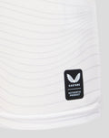 Castore authentic product patch on white jersey fabric near the hem