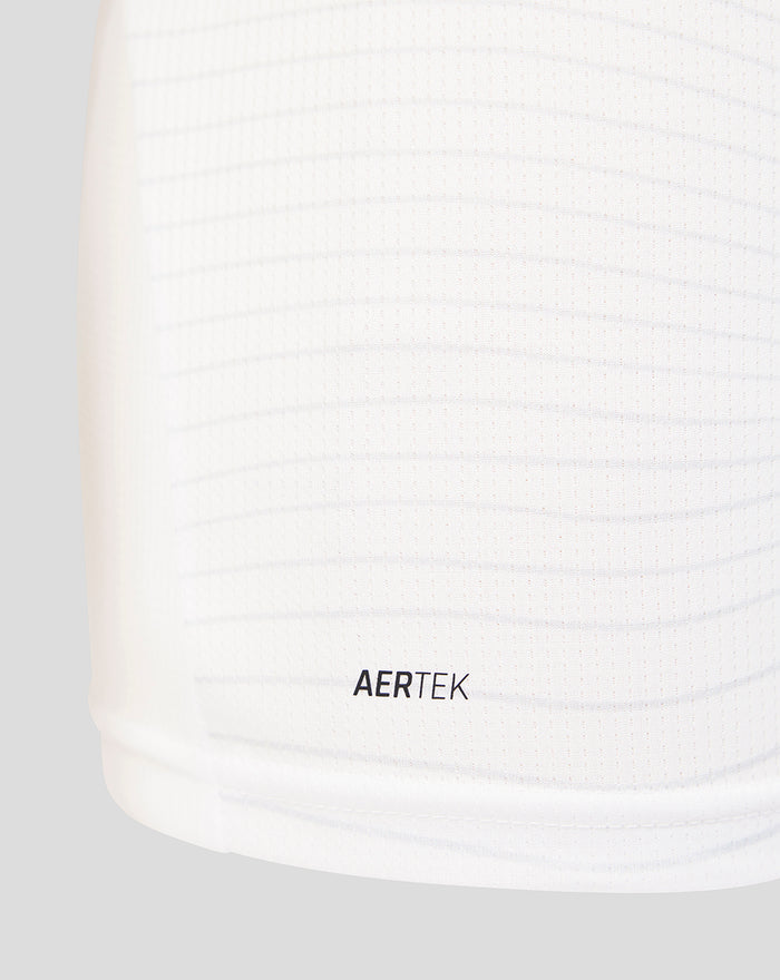 Close up of white PNE junior 2026/27 home shirt fabric with AERTEK texture