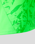 Close up of neon green goalkeeper shirt fabric with AERTEK badge and abstract print