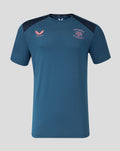 Ensign blue training short sleeve tee with navy shoulder panels and pink Castore logo beside the club crest on the chest