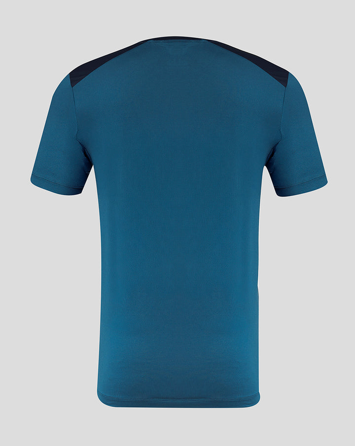 Back view of teal blue PNE training short sleeve tee with navy shoulder panels.