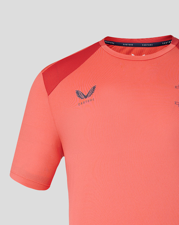Close up of rose PNE training tee showing left chest crest and navy collar trim.