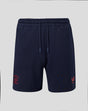 Navy Travel Adapt fleece shorts with coral crest on the left leg and a drawstring waist.