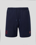 Navy Travel Adapt fleece shorts with coral crest on the left leg and a drawstring waist.