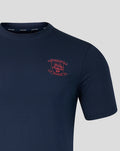 Navy travel T shirt with coral crest embroidery on the left chest, close up.