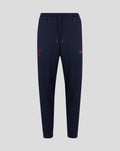 Navy Travel Adapt fleece joggers with drawstring waist, secure pockets and coral branding on the leg.