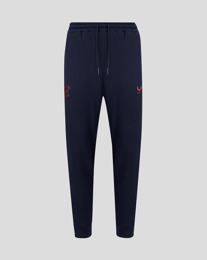 Navy Travel Adapt fleece joggers with drawstring waist, secure pockets and coral branding on the leg.