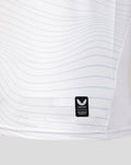 Castore authentic product patch on white jersey fabric near hem