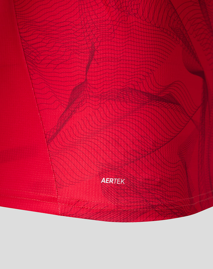 Close up of red PNE third shirt hem showing the wave pattern and AERTEK branding
