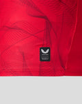Close up of red PNE third shirt fabric with Castore authentic product patch