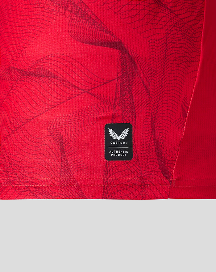 Close up of red PNE third shirt fabric with Castore authentic product patch