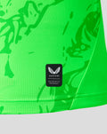Close up of neon green PNE goalkeeper shirt fabric with abstract pattern and Castore Authentic Product badge.