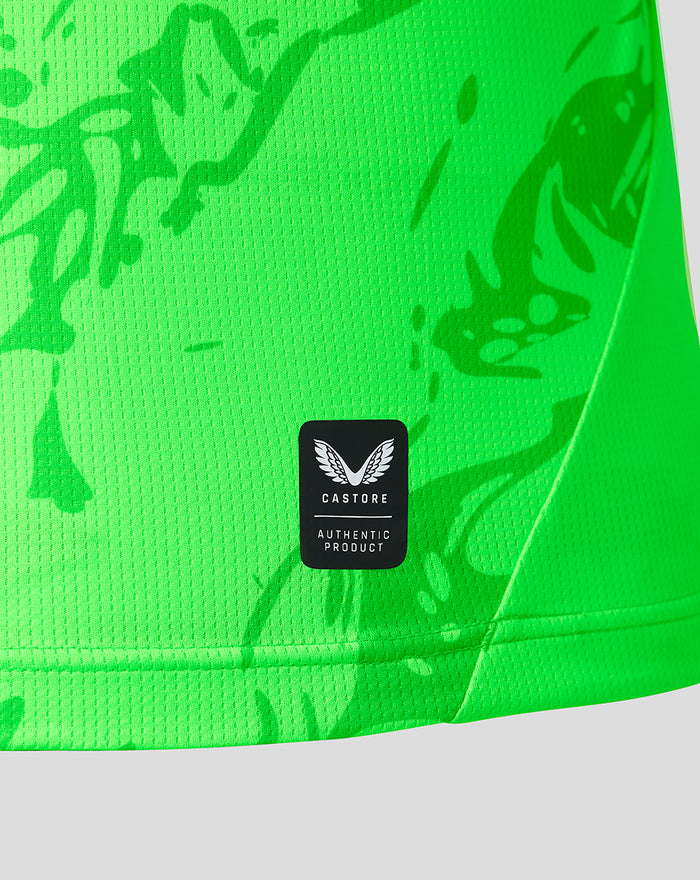 Close up of neon green PNE goalkeeper shirt fabric with abstract pattern and Castore Authentic Product badge.