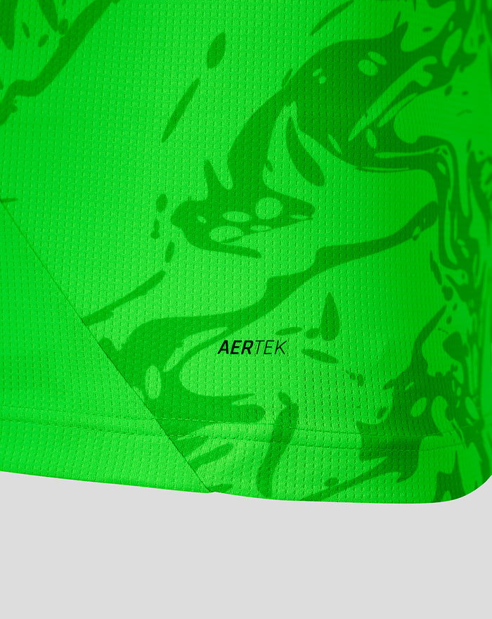 Close up of neon green jersey fabric with a textured pattern and the AERTEK branding.