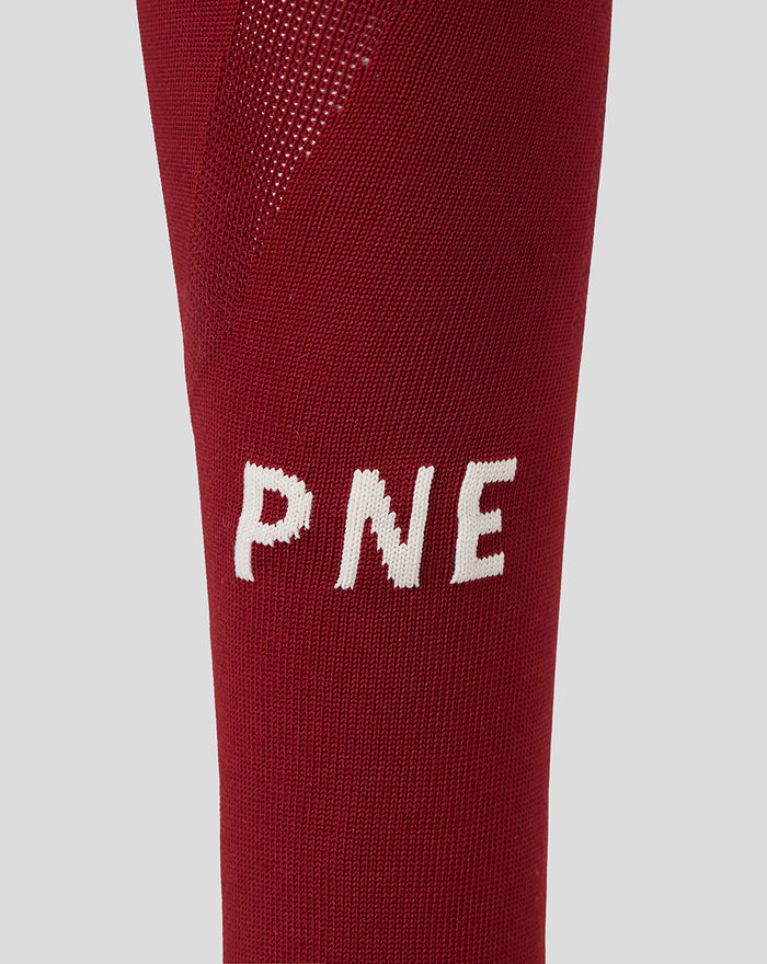 Close up of maroon Preston North End third sock with white PNE letters.