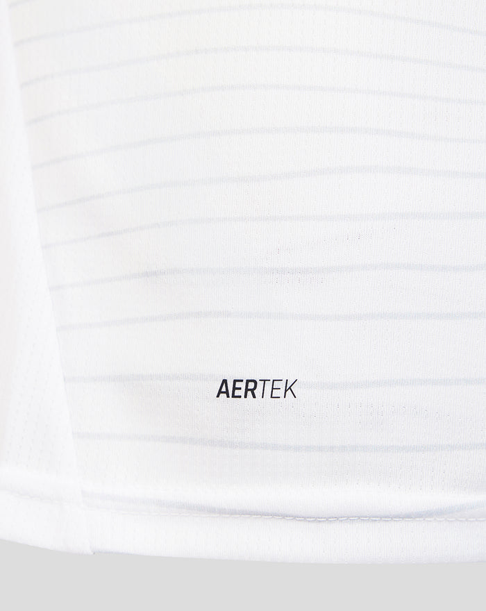 Close up of white textured fabric with AERTEK branding from the PNE 26/27 home shirt