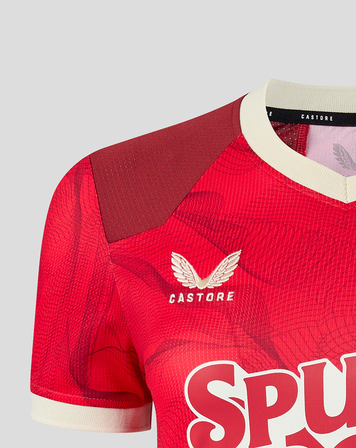 Close-up of shoulder and neckline on red PNE jersey with burgundy panels and crest