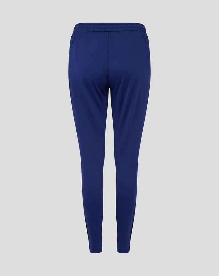 Back view of blue training pant showing elastic waistband and a printed side panel along the leg.
