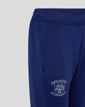 Blue women's training knit pant with elastic waistband and side pocket; white club crest near the hem.