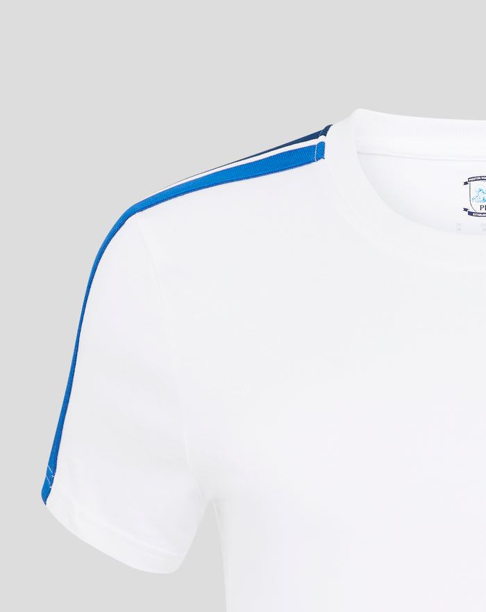 White T shirt with crest patch on chest and blue piping along the sleeve