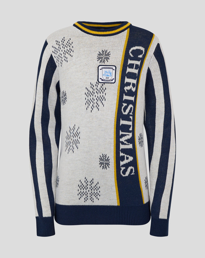 Front view of cream knit Christmas jumper featuring snowflake motifs navy striped sleeves and a crest patch on the chest.