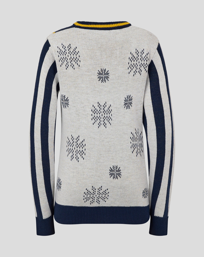 Back view of junior Christmas jumper with cream knit navy snowflake motifs and a navy hem.